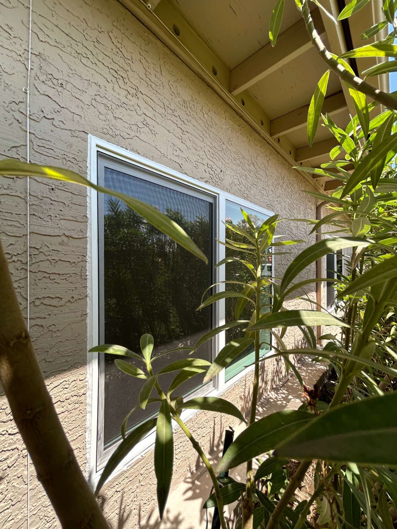 Full-window exterior sun screen installation